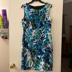 Blue floral, knee-length, sleeveless dress with accent layers